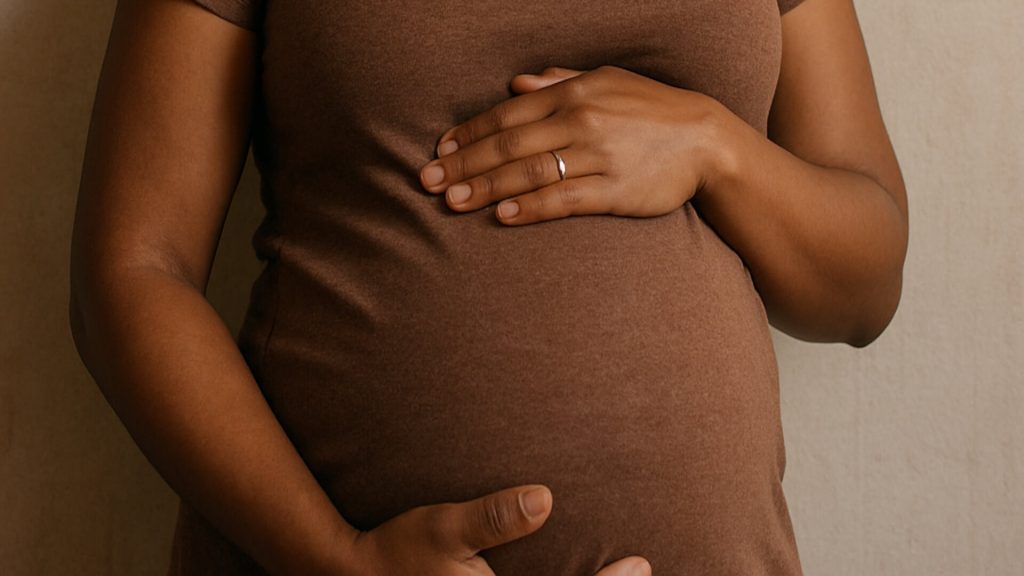 Black woman torso hands holding stomach