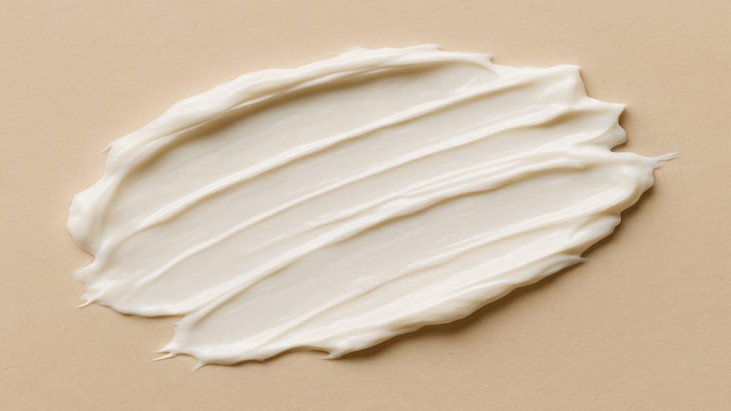 Smear of Monderma base cream on neutral palette